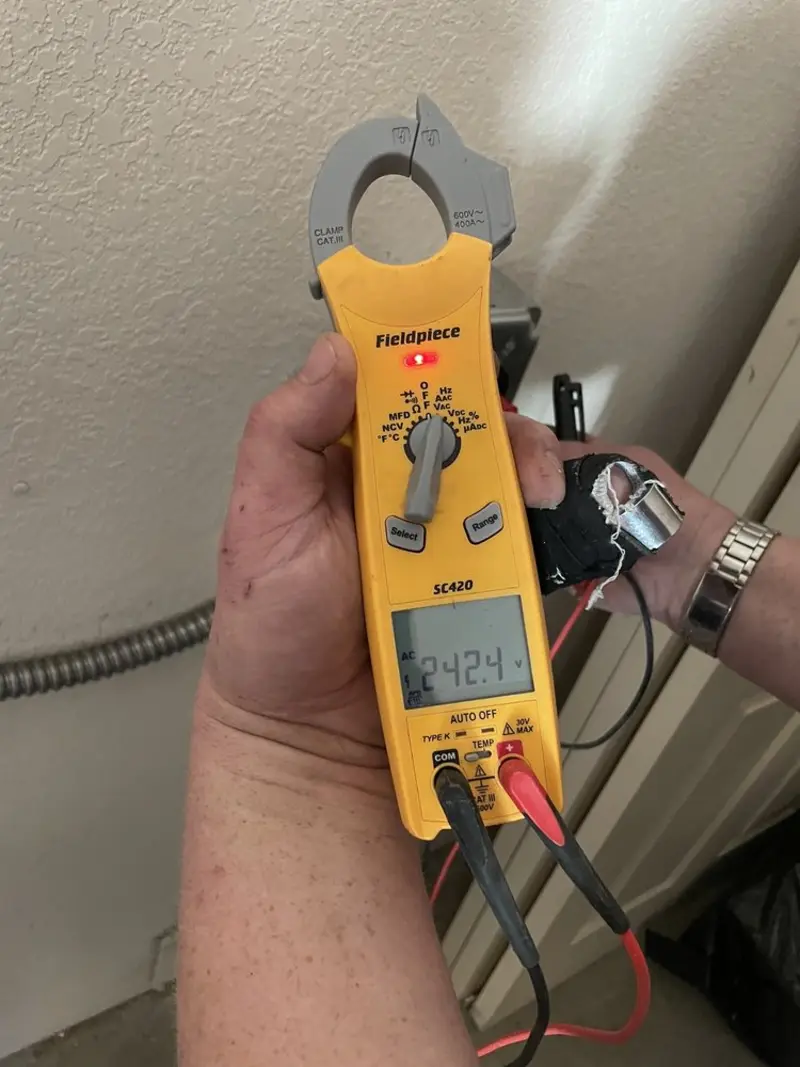 Voltage testing with clamp meter during Recessed Lighting Installation in Alliance